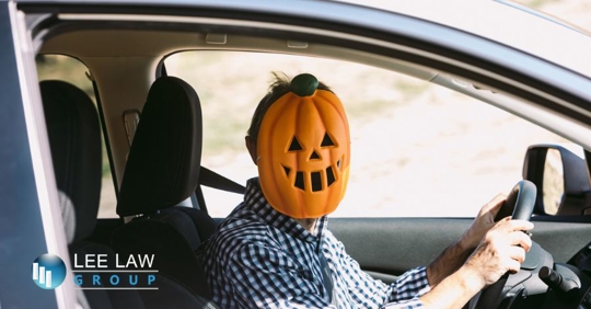 driver wearing a Halloween mask